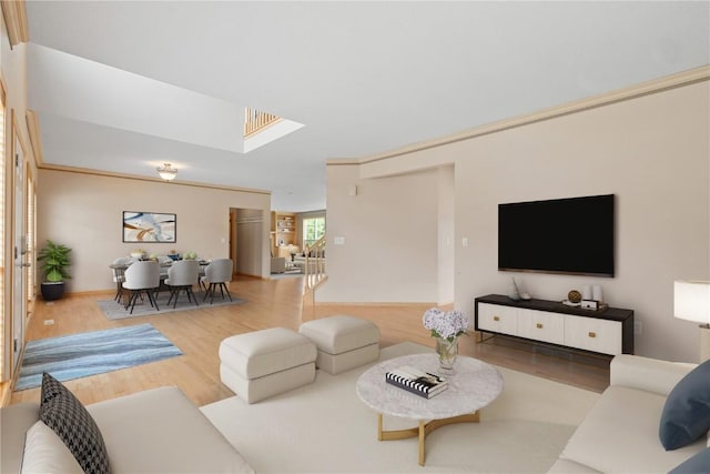 218 Teakwood Ln NE, Cedar Rapids, IA 52402 - living area with wood finished floors and a skylight