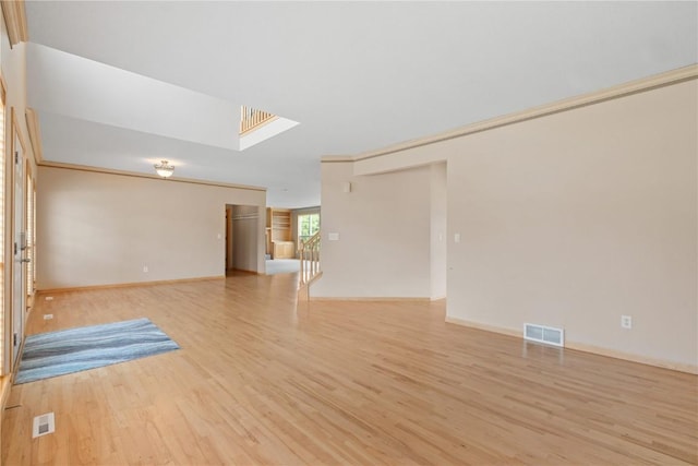 218 Teakwood Ln NE, Cedar Rapids, IA 52402 - unfurnished living room featuring light wood finished floors and a skylight