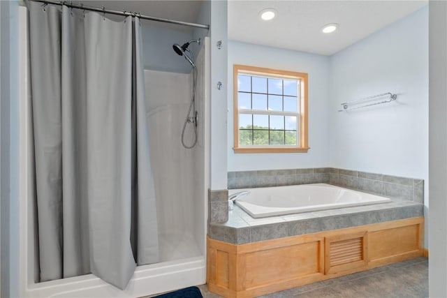 218 Teakwood Ln NE, Cedar Rapids, IA 52402 - full bathroom with a stall shower, a garden tub, and recessed lighting