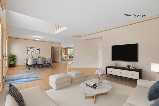 218 Teakwood Ln NE, Cedar Rapids, IA 52402 - living area with wood finished floors and a skylight
