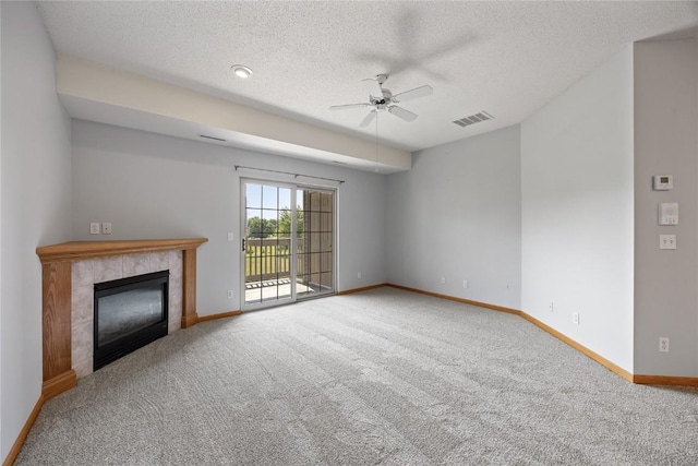 250 Cimarron Dr NE, Hiawatha, IA 52233 - unfurnished living room with carpet flooring, ceiling fan, a fireplace, and a textured ceiling