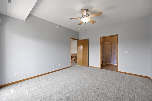 250 Cimarron Dr NE, Hiawatha, IA 52233 - unfurnished bedroom with carpet, ensuite bathroom, and a ceiling fan