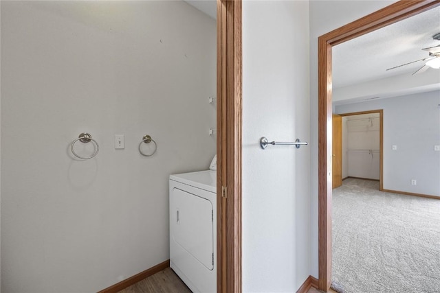 250 Cimarron Dr NE, Hiawatha, IA 52233 - laundry area with washer / dryer, ceiling fan, and light carpet