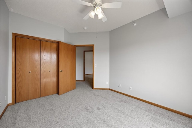 250 Cimarron Dr NE, Hiawatha, IA 52233 - unfurnished bedroom with carpet flooring, a closet, and a ceiling fan