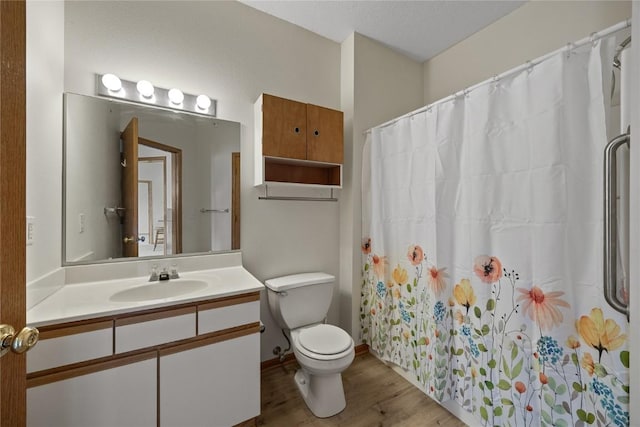 250 Cimarron Dr NE, Hiawatha, IA 52233 - full bathroom featuring wood finished floors, vanity, and a shower with curtain