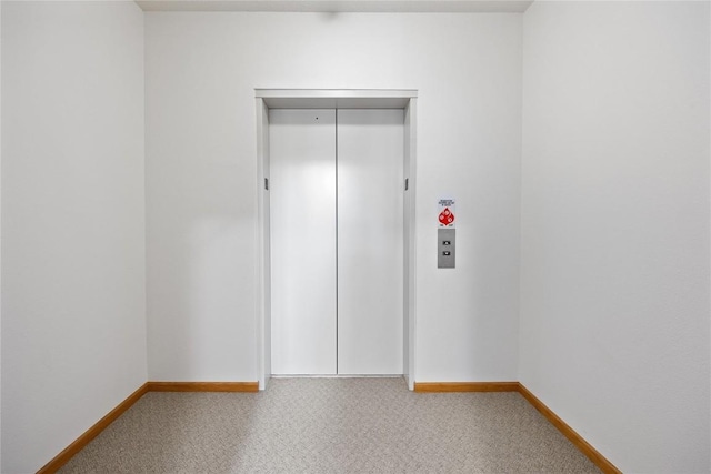 250 Cimarron Dr NE, Hiawatha, IA 52233 - carpeted spare room with elevator and baseboards