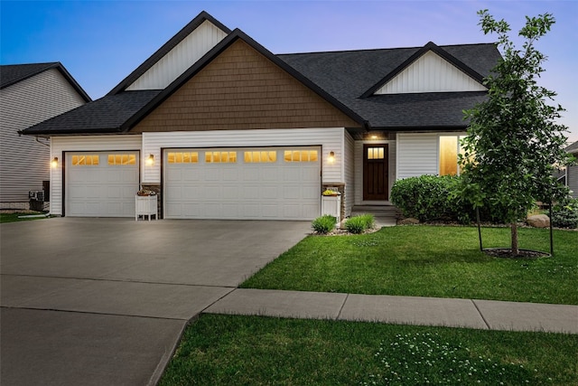 4263 Calder Dr, Marion, IA 52302 - view of front of property with a garage, concrete driveway, board and batten siding, and a front lawn