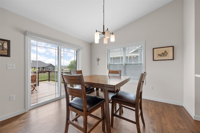 4263 Calder Dr, Marion, IA 52302 - dining area featuring a chandelier, wood finished floors, and lofted ceiling
