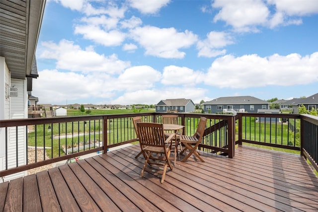 4263 Calder Dr, Marion, IA 52302 - wooden terrace featuring a residential view, a yard, and outdoor dining space