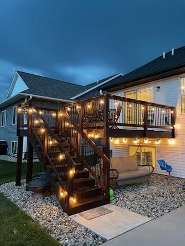4263 Calder Dr, Marion, IA 52302 - rear view of house featuring stairway, a deck, and roof with shingles