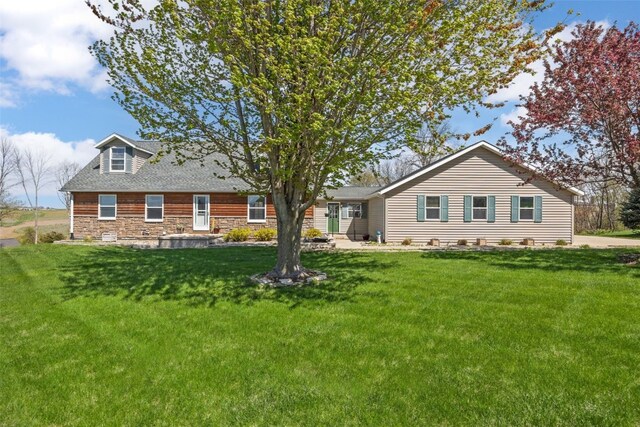 13294 212th Ave, Anamosa, IA 52205 - view of front of property featuring a front yard and stone siding