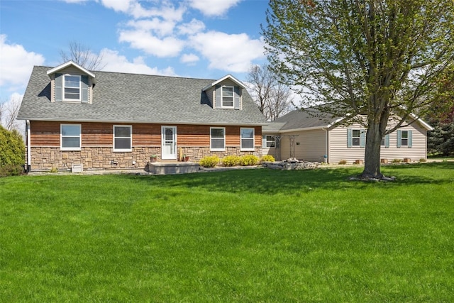 13294 212th Ave, Anamosa, IA 52205 - view of front of house with stone siding, a front yard, and a shingled roof