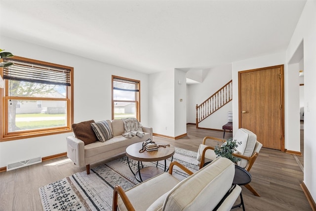 13294 212th Ave, Anamosa, IA 52205 - living area with stairway and wood finished floors