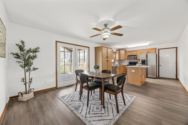 13294 212th Ave, Anamosa, IA 52205 - dining area featuring ceiling fan and wood finished floors