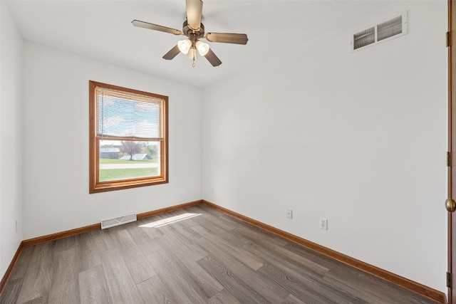 13294 212th Ave, Anamosa, IA 52205 - spare room featuring wood finished floors and ceiling fan