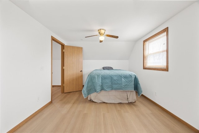 13294 212th Ave, Anamosa, IA 52205 - bedroom featuring light wood-style flooring, a ceiling fan, and lofted ceiling