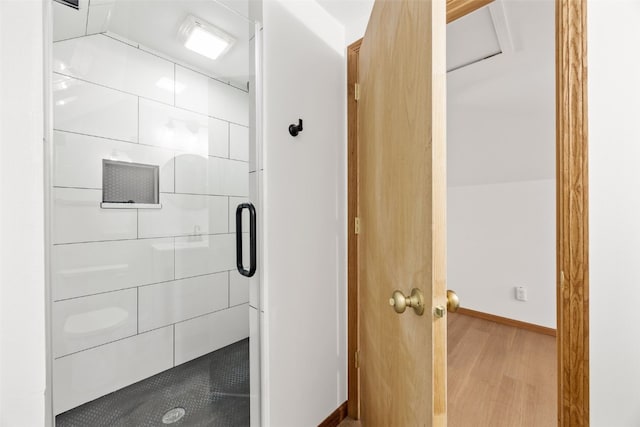 13294 212th Ave, Anamosa, IA 52205 - bathroom featuring a stall shower and wood finished floors
