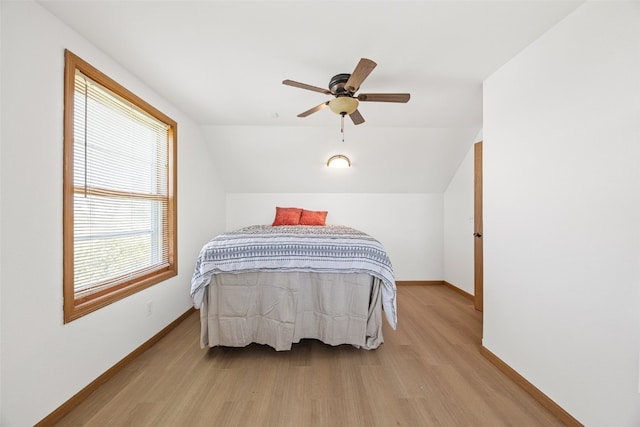 13294 212th Ave, Anamosa, IA 52205 - bedroom featuring wood finished floors, vaulted ceiling, and ceiling fan