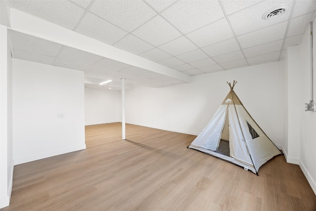 13294 212th Ave, Anamosa, IA 52205 - rec room with a drop ceiling and wood finished floors