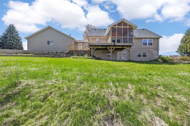 13294 212th Ave, Anamosa, IA 52205 - rear view of property featuring a sunroom, a deck, and a yard