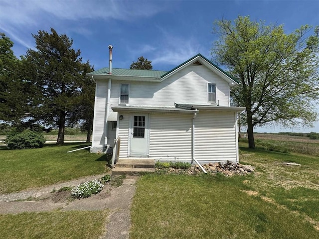 3367 Frost Ave, Brandon, IA 52210 - rear view of property featuring a yard and a metal roof