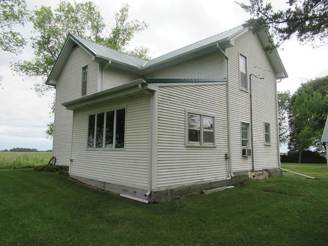 3367 Frost Ave, Brandon, IA 52210 - view of side of home featuring a lawn, a metal roof, and cooling unit