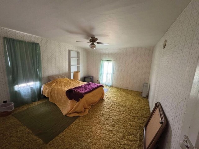 3367 Frost Ave, Brandon, IA 52210 - bedroom featuring wallpapered walls, ceiling fan, and carpet floors