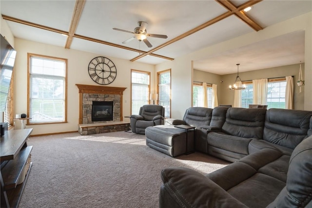 765 34th Ave, Marion, IA 52302 - carpeted living area with a chandelier, ceiling fan, a stone fireplace, plenty of natural light, and beamed ceiling