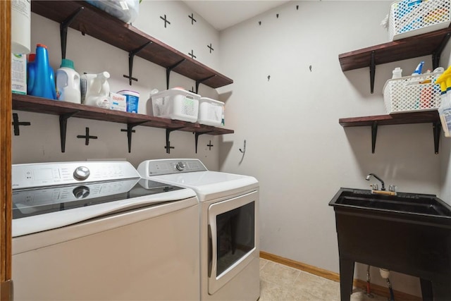 765 34th Ave, Marion, IA 52302 - laundry area with washing machine and dryer and light tile patterned floors