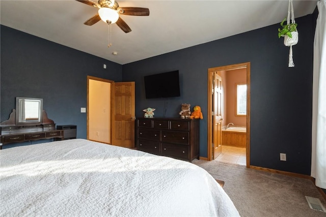 765 34th Ave, Marion, IA 52302 - bedroom featuring carpet, connected bathroom, and a ceiling fan