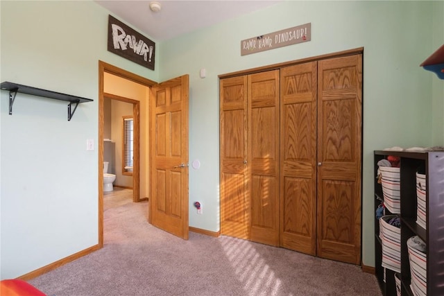765 34th Ave, Marion, IA 52302 - bedroom featuring light colored carpet and a closet