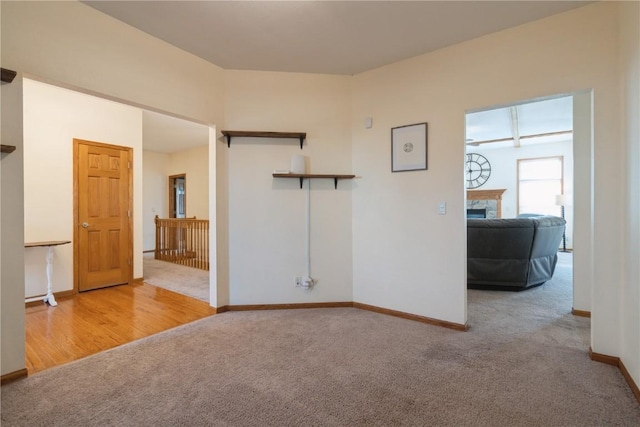 765 34th Ave, Marion, IA 52302 - carpeted spare room with baseboards and a fireplace
