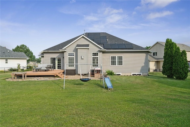 765 34th Ave, Marion, IA 52302 - back of property with a deck and roof mounted solar panels