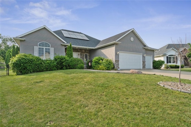 765 34th Ave, Marion, IA 52302 - traditional home with an attached garage, solar panels, driveway, and a shingled roof