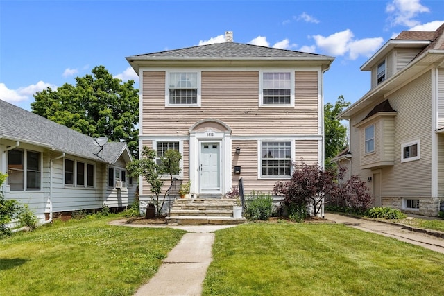 1812 Blake Blvd SE, Cedar Rapids, IA 52403 - view of front of property with a front lawn and a chimney