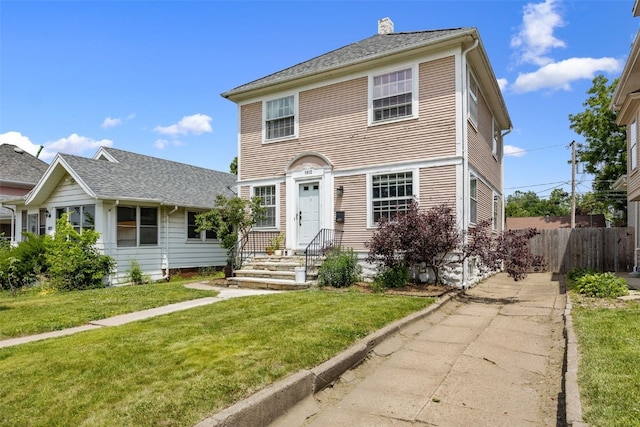 1812 Blake Blvd SE, Cedar Rapids, IA 52403 - view of front facade featuring a chimney and driveway