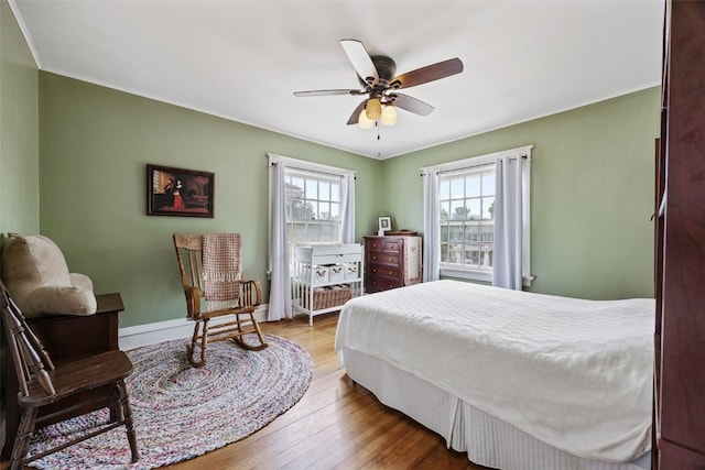 1812 Blake Blvd SE, Cedar Rapids, IA 52403 - bedroom with wood-type flooring and a ceiling fan