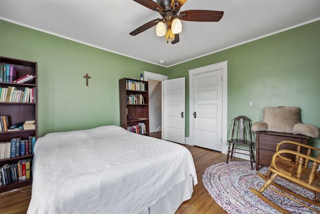 1812 Blake Blvd SE, Cedar Rapids, IA 52403 - bedroom featuring ornamental molding, wood finished floors, and ceiling fan