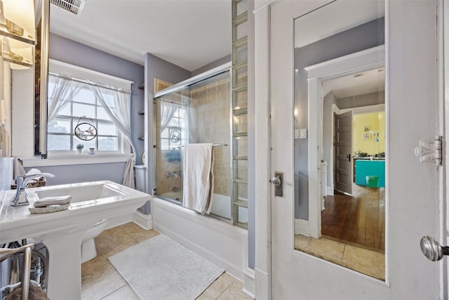 1812 Blake Blvd SE, Cedar Rapids, IA 52403 - bathroom with tile patterned flooring and enclosed tub / shower combo