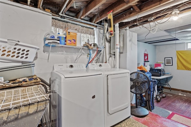 1812 Blake Blvd SE, Cedar Rapids, IA 52403 - washroom featuring washing machine and dryer and wood finished floors
