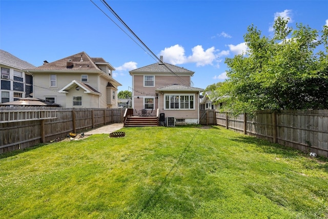 1812 Blake Blvd SE, Cedar Rapids, IA 52403 - rear view of house with a fenced backyard and a wooden deck
