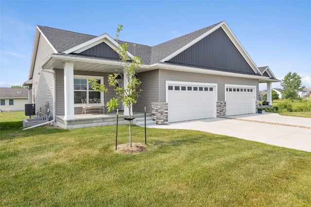 6415 Rookwood Ln, Marion, IA 52302 - craftsman inspired home with covered porch, concrete driveway, an attached garage, a front lawn, and a shingled roof