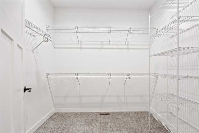 6415 Rookwood Ln, Marion, IA 52302 - walk in closet featuring carpet flooring