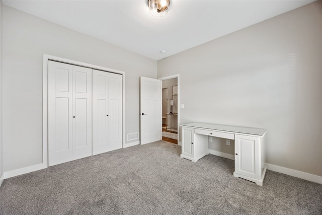 6415 Rookwood Ln, Marion, IA 52302 - unfurnished bedroom with light colored carpet, an office area, and a closet