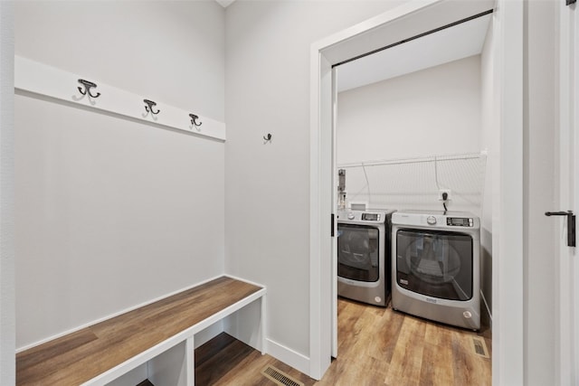 6415 Rookwood Ln, Marion, IA 52302 - laundry area featuring washing machine and dryer and light wood finished floors