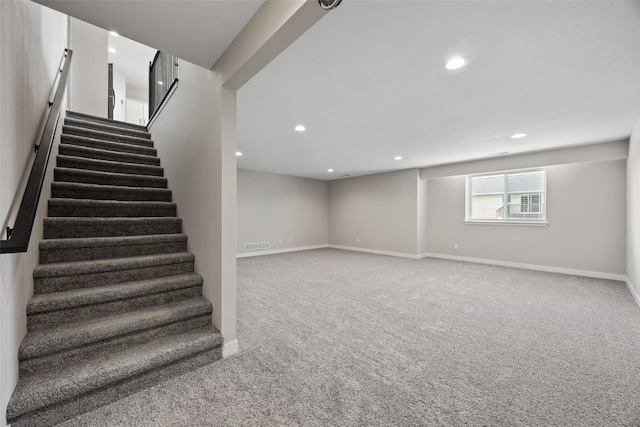 6415 Rookwood Ln, Marion, IA 52302 - below grade area featuring stairway, carpet floors, and recessed lighting
