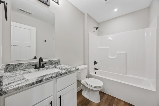 6415 Rookwood Ln, Marion, IA 52302 - bathroom featuring wood finished floors, vanity, and  shower combination