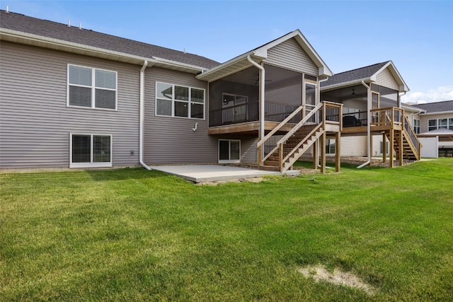 6415 Rookwood Ln, Marion, IA 52302 - back of property with a sunroom, stairway, ceiling fan, a patio, and a lawn