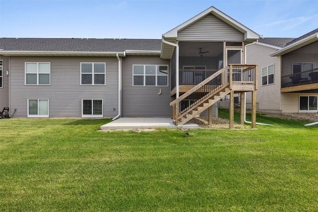 6415 Rookwood Ln, Marion, IA 52302 - back of property with a sunroom, a lawn, a patio, and a shingled roof