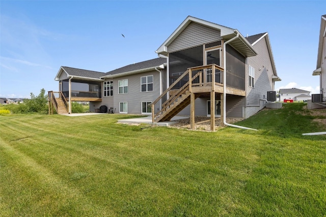 6415 Rookwood Ln, Marion, IA 52302 - back of house featuring a sunroom, stairs, and a yard